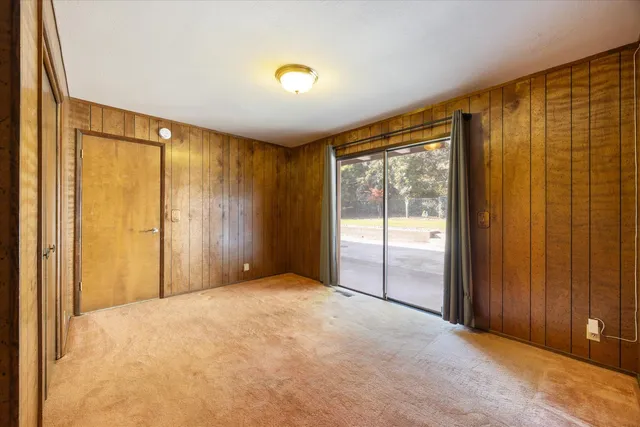 a front view of a house with a large space in front of it