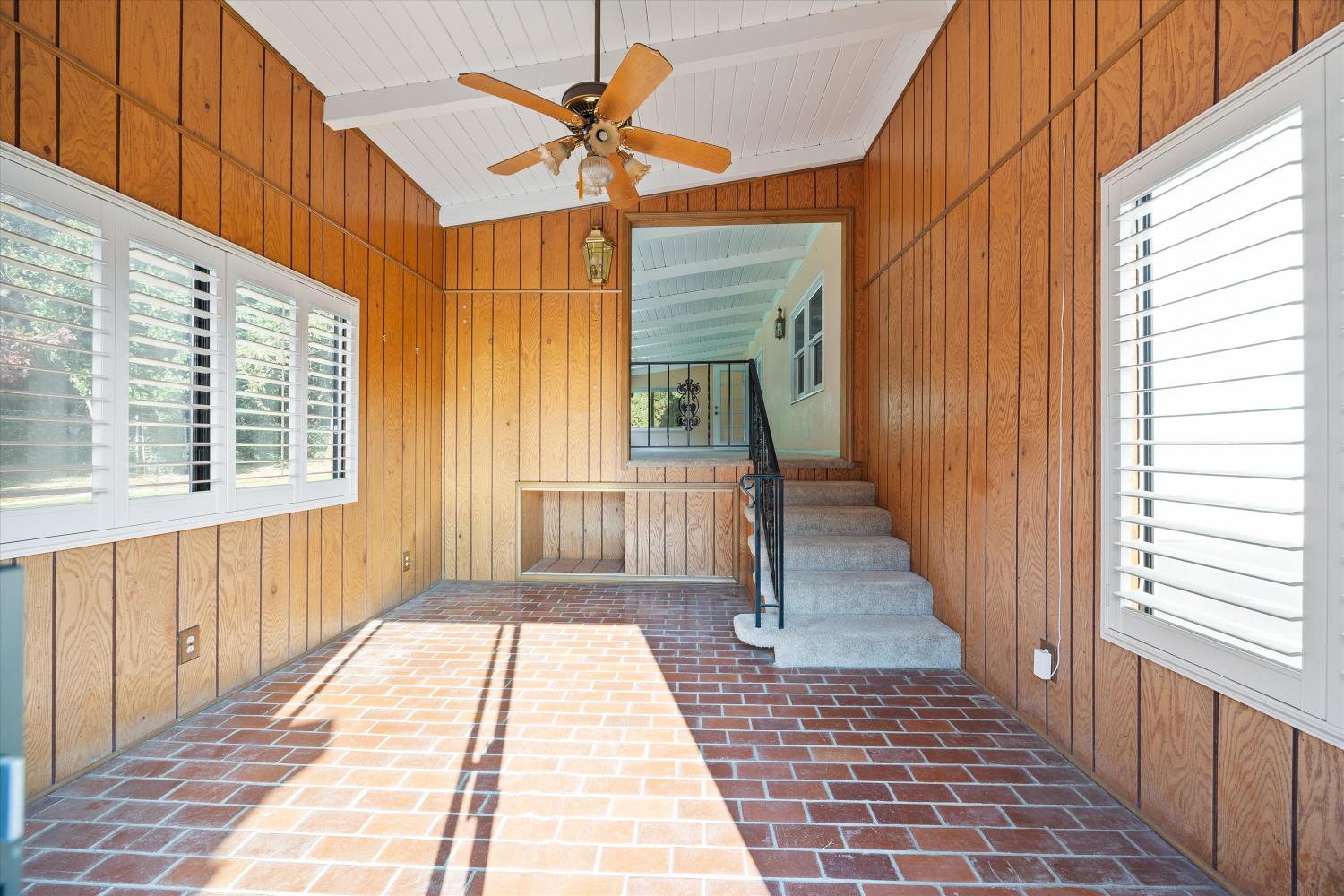 1786 Le Bec Court Lodi, CA 95240 - Photo 47 of 65 a view of a porch with wooden floor and fence