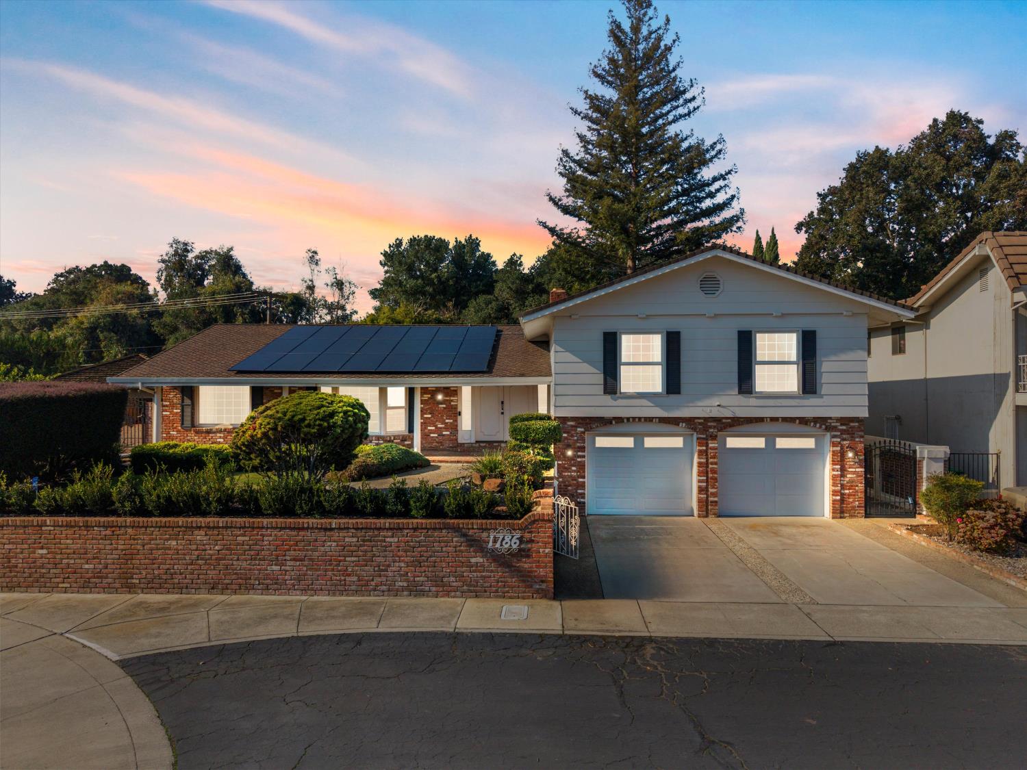 1786 Le Bec Court Lodi, CA 95240 - Photo 6 of 65 a front view of a house with a yard