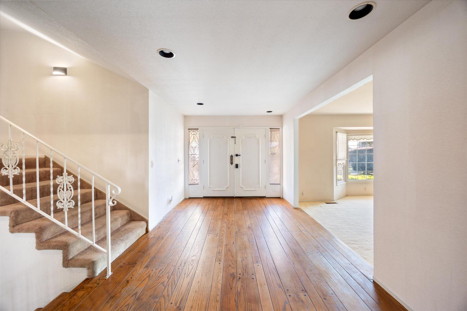 1786 Le Bec Court Lodi, CA 95240 - Photo 7 of 65 a view of an entryway with wooden floor