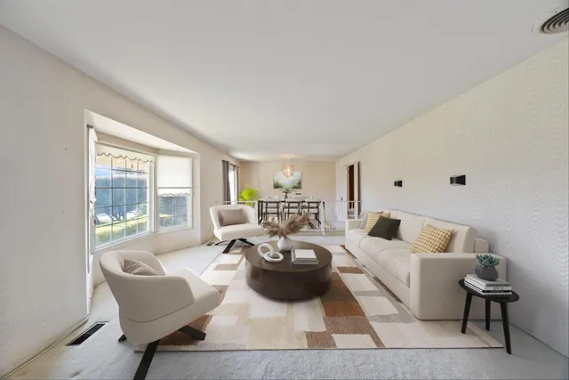 a view of a dining room with furniture window and outside view