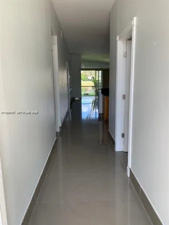 a view of hallway with livingroom