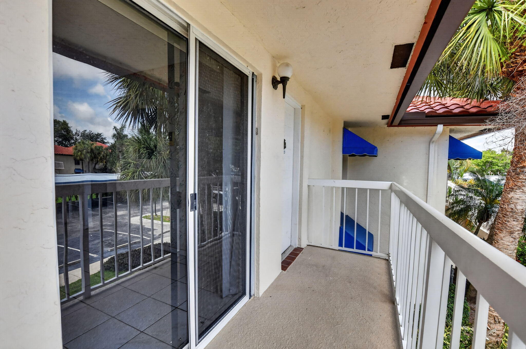 280 Northwest 67th Street, Unit B203 Boca Raton, FL 33487 - Photo 2 of 16 Front Balcony