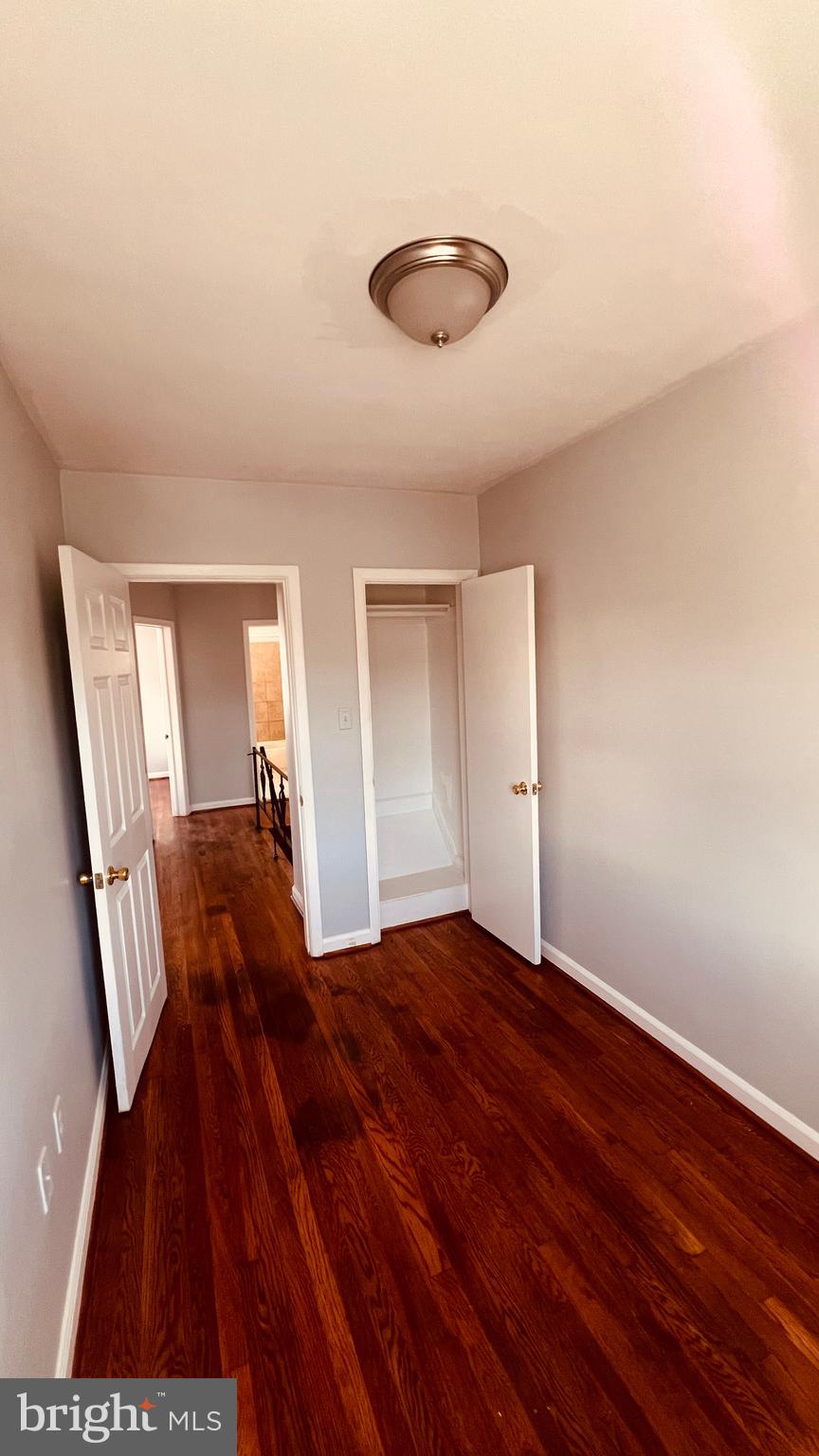 4413 Fenor Road Halethorpe, MD 21227 - Photo 23 of 31 a bedroom with a bed and a chair