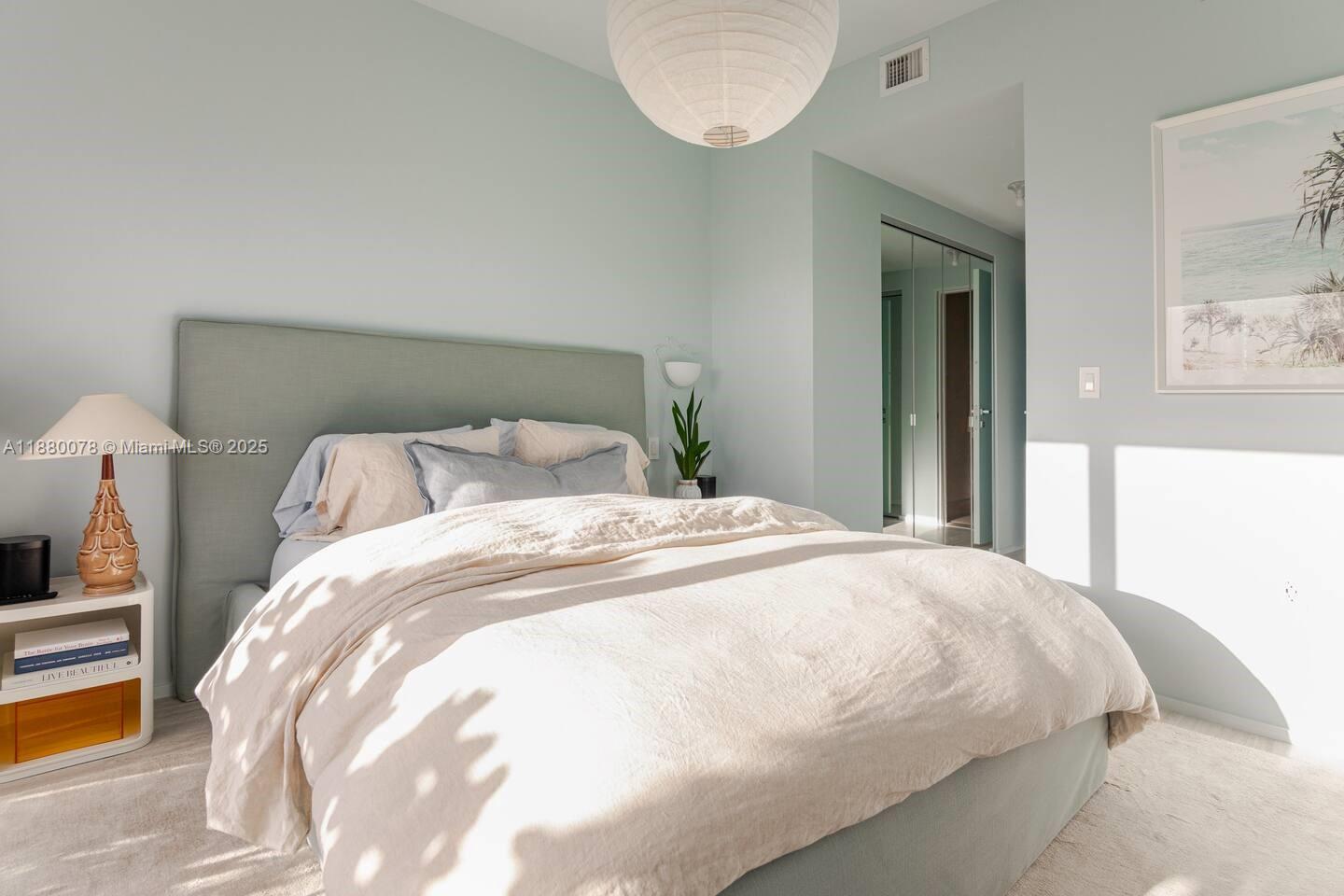 121 Northeast 34th Street, Unit 2408 Miami, FL 33137 - Photo 18 of 48 a large white bed in a bedroom next to a window