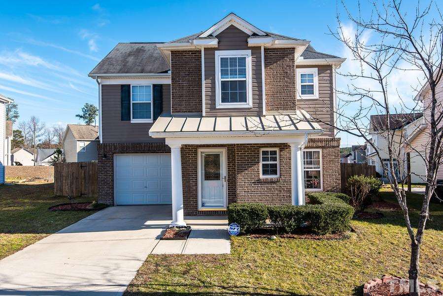 2643 Quarry Springs Road Raleigh, NC 27610 - Photo 1 of 19 a front view of a house with yard