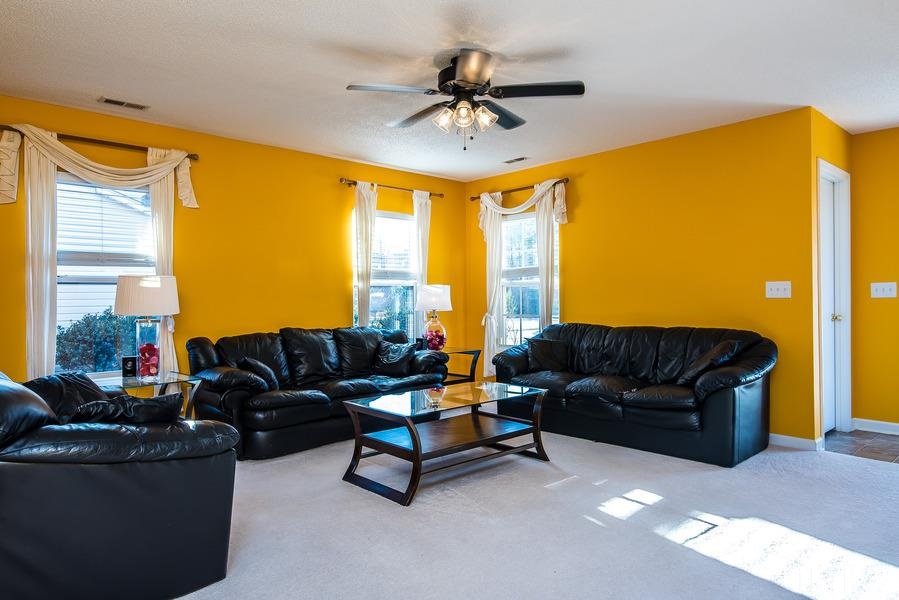 2643 Quarry Springs Road Raleigh, NC 27610 - Photo 3 of 19 a living room with furniture and a large window