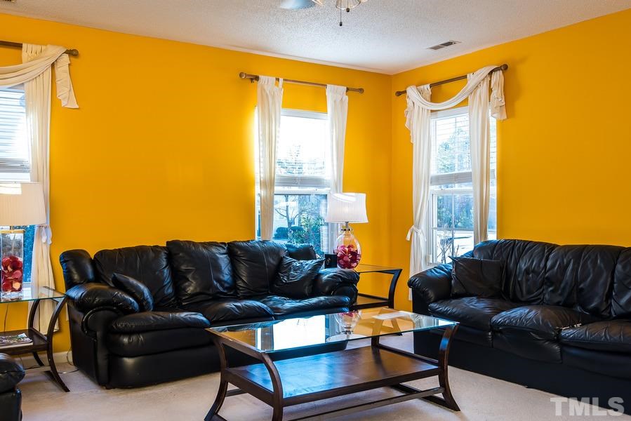 2643 Quarry Springs Road Raleigh, NC 27610 - Photo 4 of 19 a living room with furniture and a large window