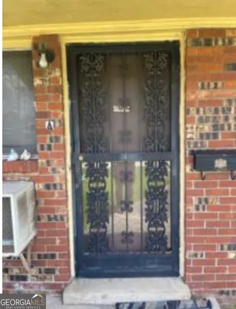 a view of a glass door of the house