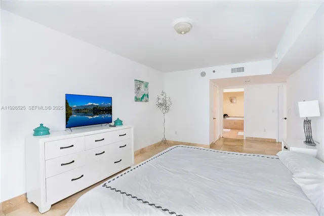 a bedroom with a bed and furniture