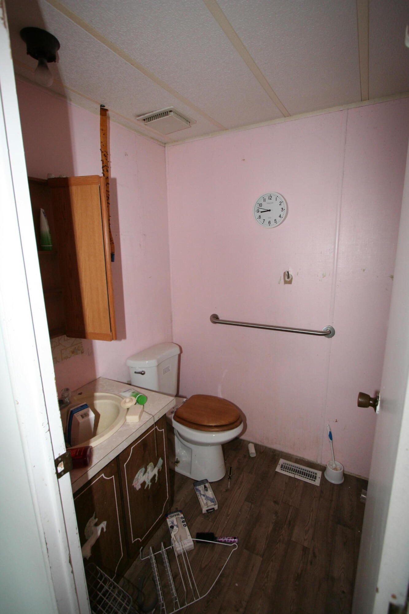 24667 Sprague River Road Sprague River, OR 97639 - Photo 16 of 38 a bathroom with a sink a toilet a mirror and vanity