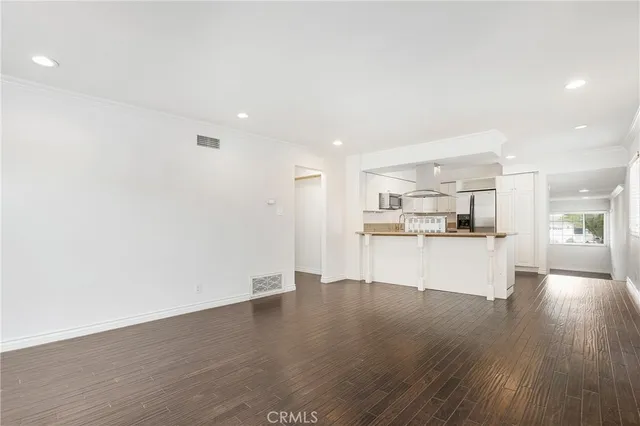 a view of kitchen view with wooden floor and kitchen