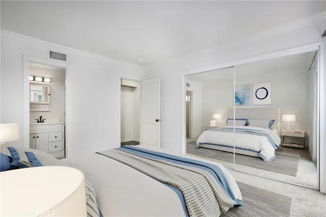 a bedroom with a bed and a couch