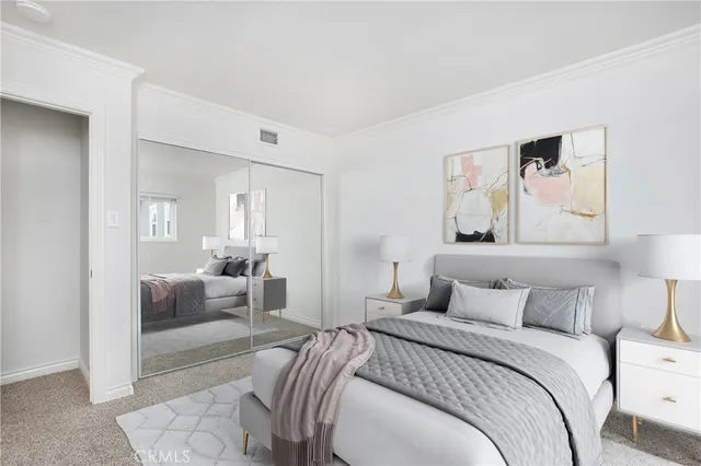 a bedroom with a bed and a couch