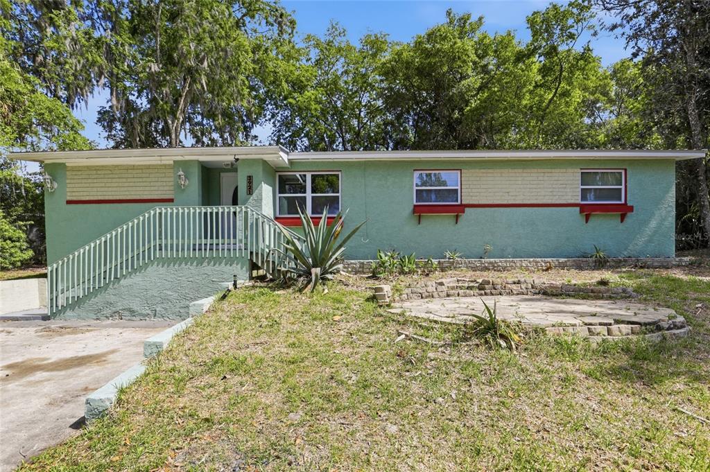 front view of a house with a yard