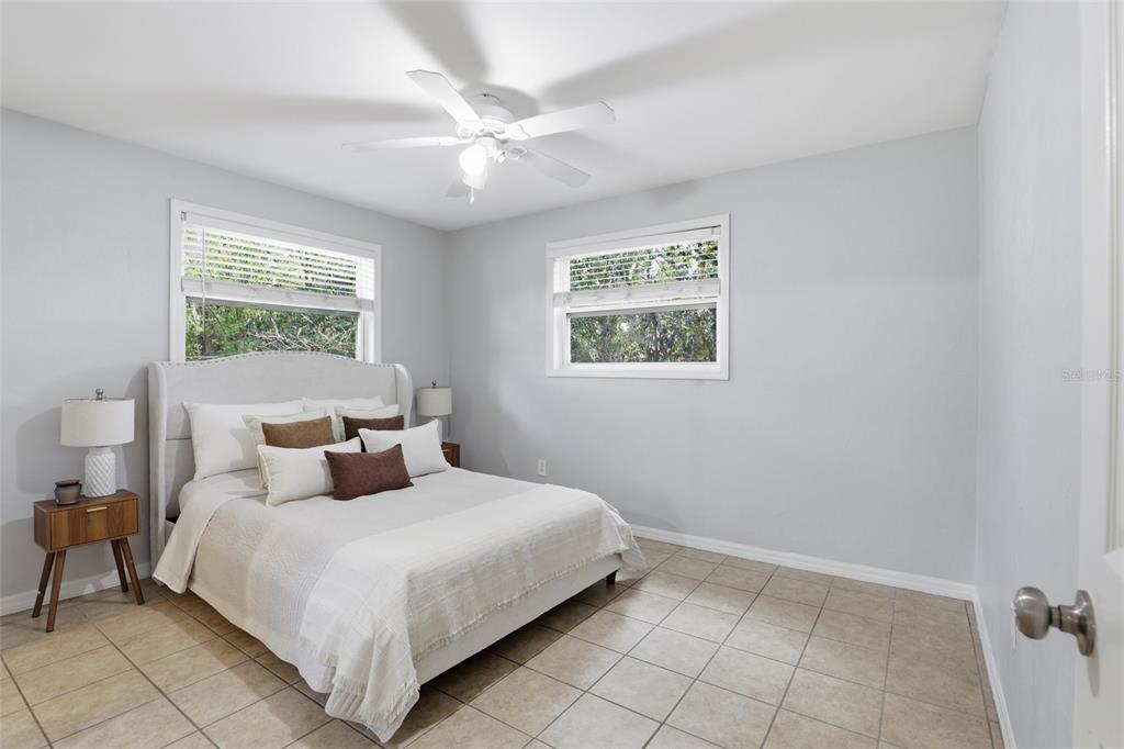 3921 Southeast 14th Terrace Gainesville, FL 32641 - Photo 18 of 32 a bedroom with a large bed and a window