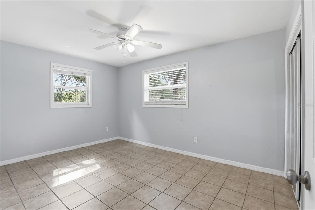 3921 Southeast 14th Terrace Gainesville, FL 32641 - Photo 22 of 32 a view of an empty room with window and cabinet