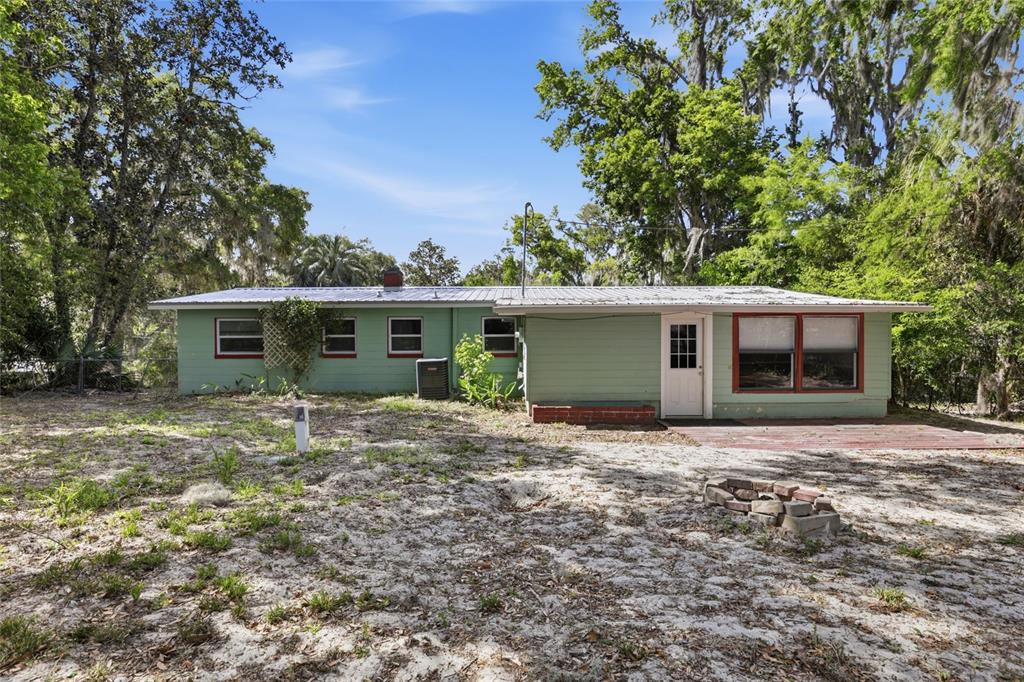 3921 Southeast 14th Terrace Gainesville, FL 32641 - Photo 27 of 32 a view of a house with a yard and large tree