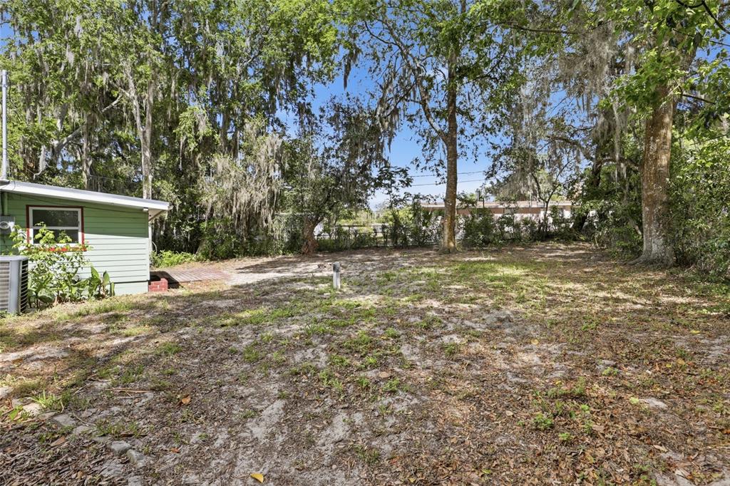 3921 Southeast 14th Terrace Gainesville, FL 32641 - Photo 29 of 32 a backyard of a house with table and chairs