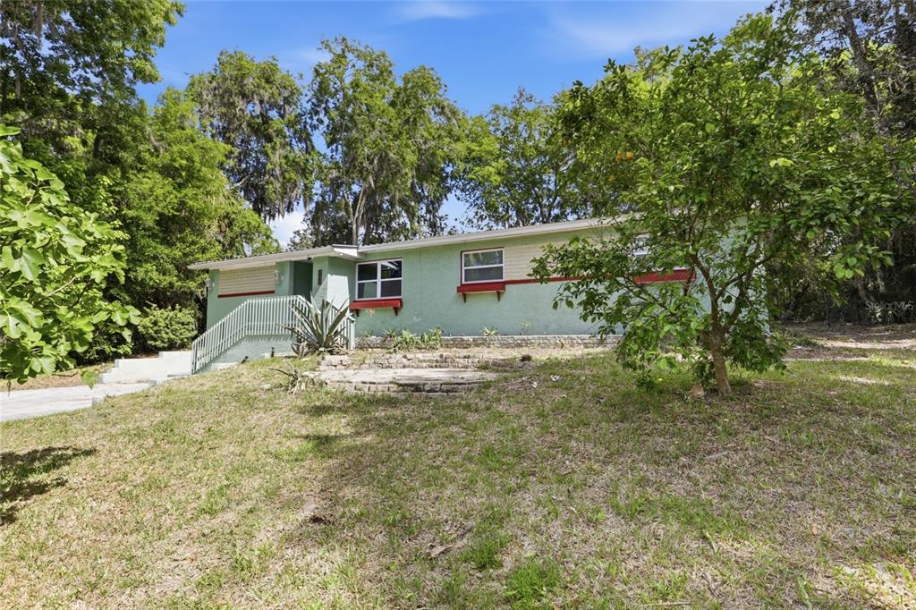 3921 Southeast 14th Terrace Gainesville, FL 32641 - Photo 30 of 32 a view of a house with a yard