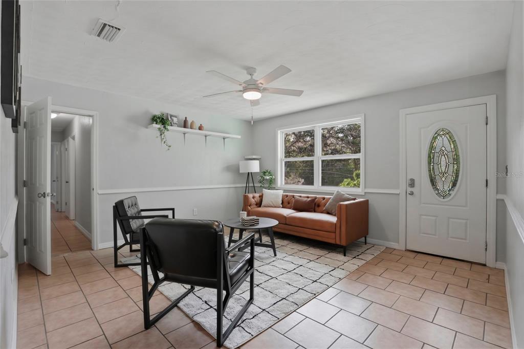3921 Southeast 14th Terrace Gainesville, FL 32641 - Photo 3 of 32 a living room with furniture a window and a table