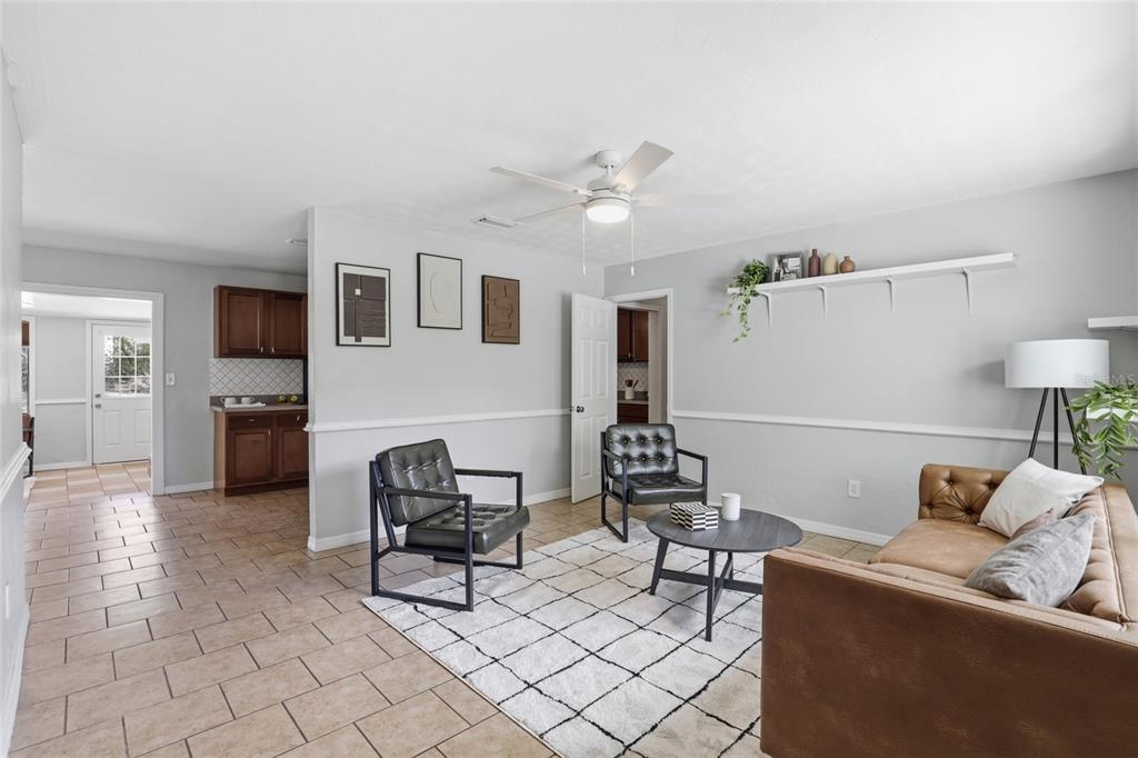 3921 Southeast 14th Terrace Gainesville, FL 32641 - Photo 6 of 32 a living room with furniture and wooden floor