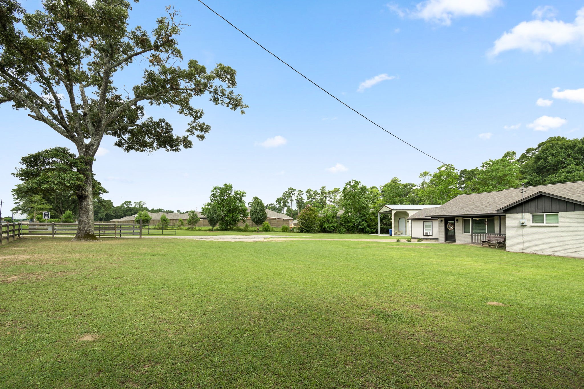 25311 Hardin Store Road Pinehurst, TX 77362 - Photo 3 of 39 a view of a house with a big yard