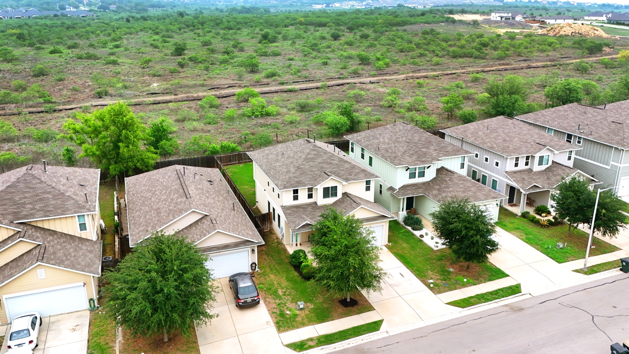 281 Guemal Road Buda, TX 78610 - Photo 5 of 30 an aerial view of a house with garden space and street view