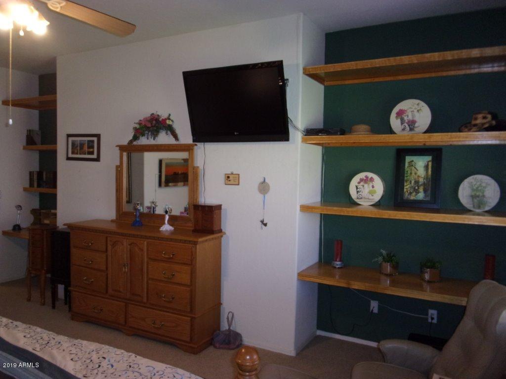 2742 East Harwell Road Gilbert, AZ 85234 - Photo 11 of 45 a living room with furniture and a flat screen tv