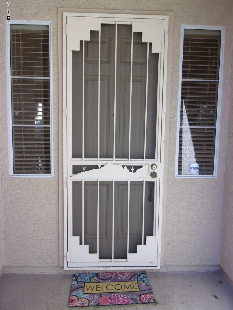 2742 East Harwell Road Gilbert, AZ 85234 - Photo 21 of 45 a view of wooden door with a house