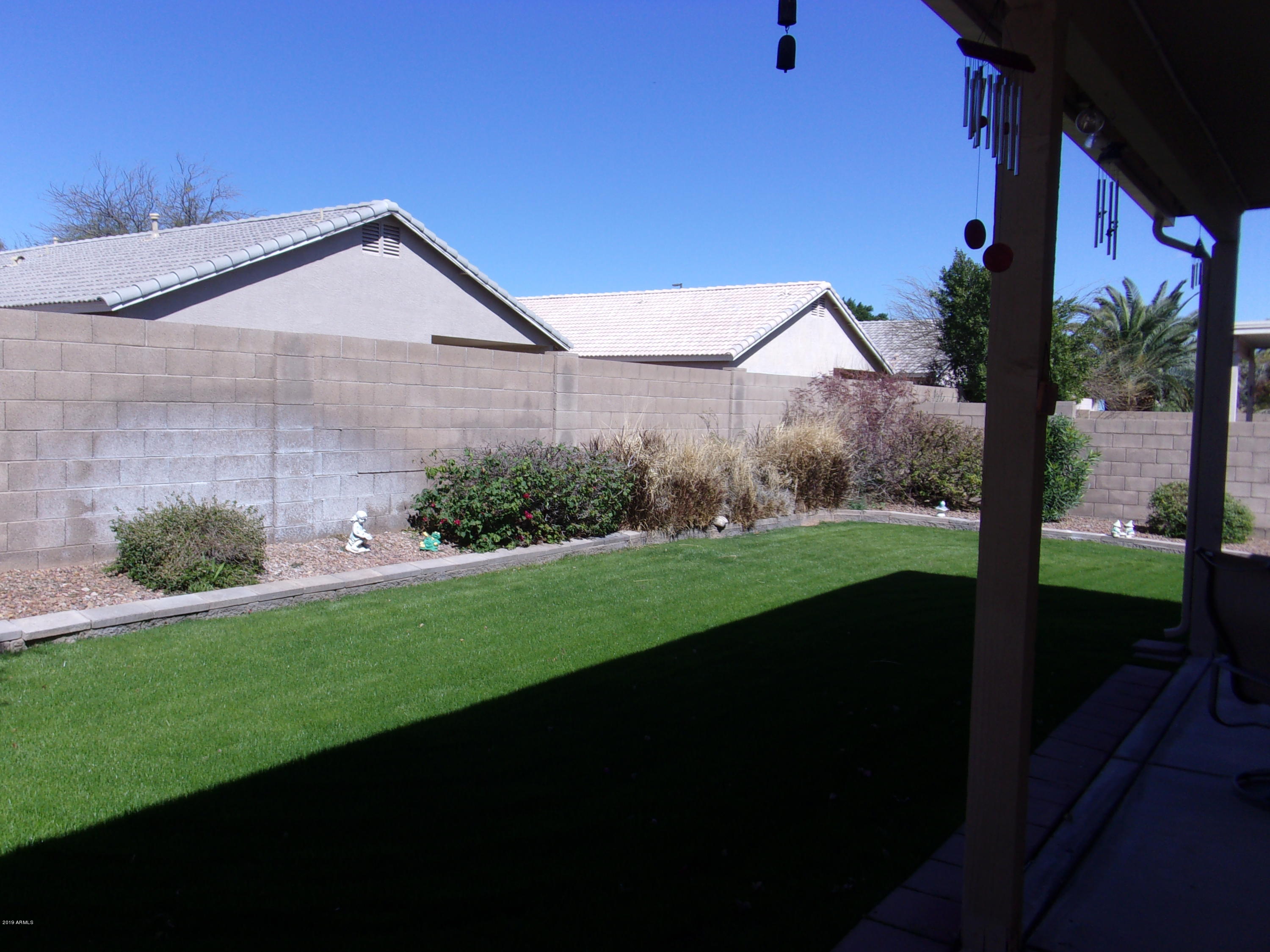 2742 East Harwell Road Gilbert, AZ 85234 - Photo 32 of 45 a view of a house with backyard and garden
