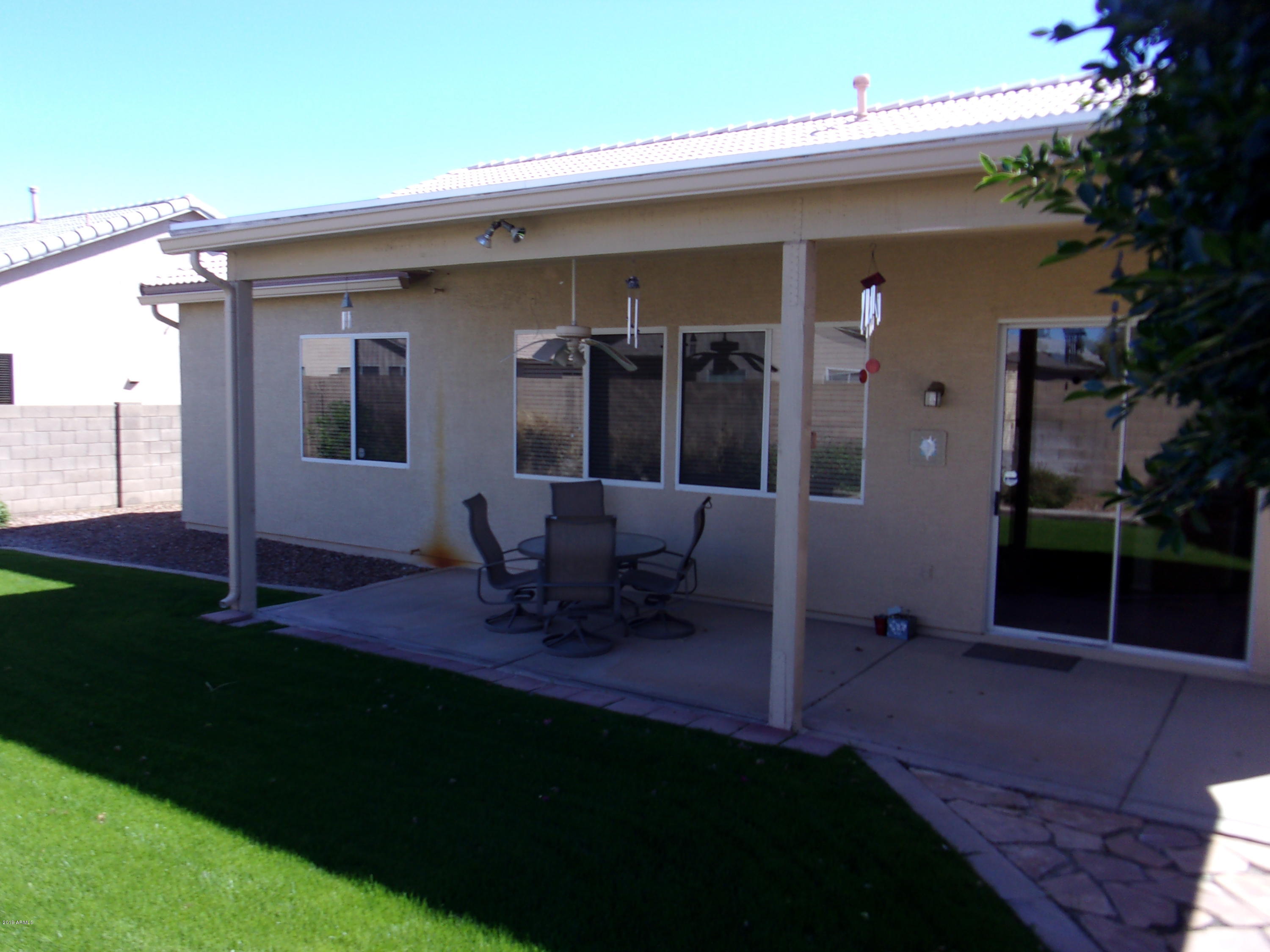 2742 East Harwell Road Gilbert, AZ 85234 - Photo 34 of 45 a view of backyard of the house with outdoor seating and barbeque oven