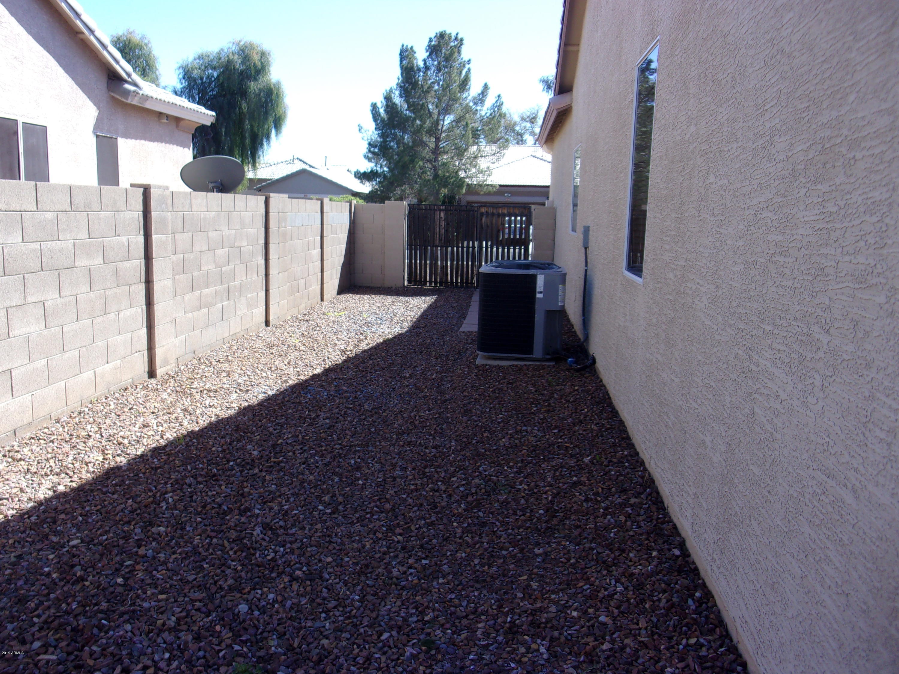 2742 East Harwell Road Gilbert, AZ 85234 - Photo 37 of 45 a view of a house with a yard