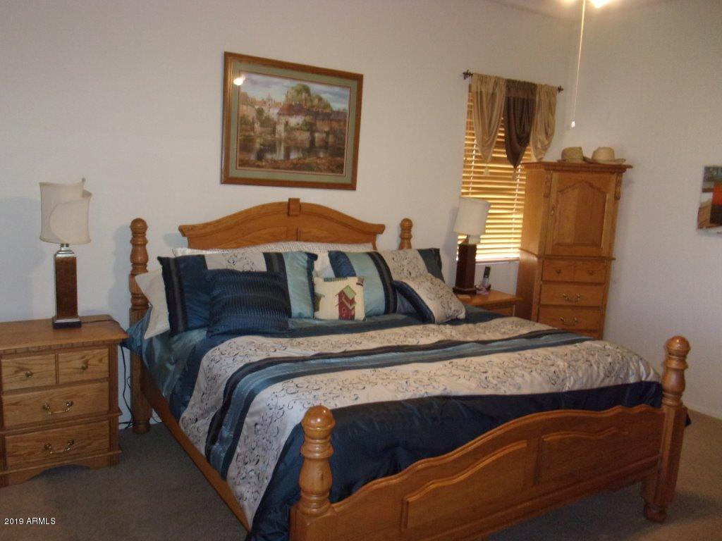 2742 East Harwell Road Gilbert, AZ 85234 - Photo 9 of 45 a bedroom with a bed and window