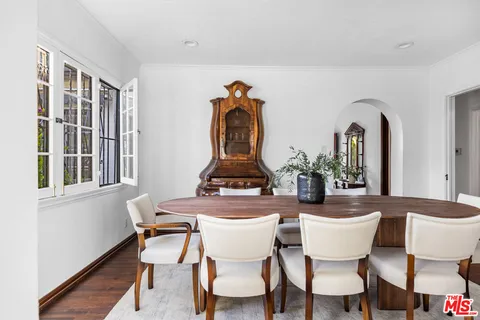 a kitchen with stainless steel appliances granite countertop a stove and white cabinets
