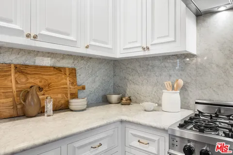 a living room with furniture and a painting