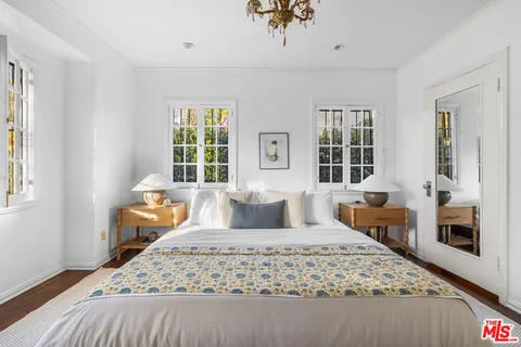 a bed room with furniture and a window