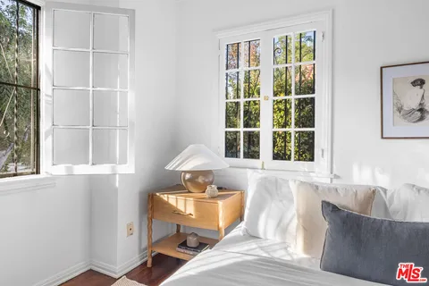 a white toilet sitting next to a shower