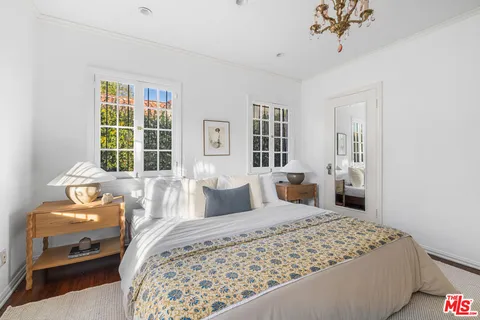 a bedroom with a bed and a couch