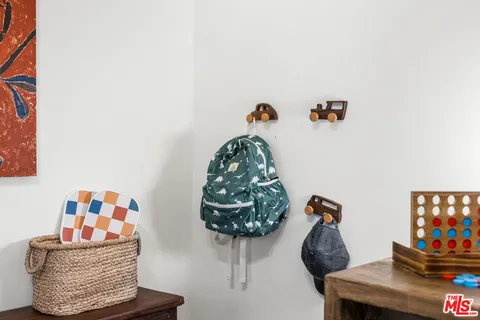 a view of a patio with table and chairs and potted plants