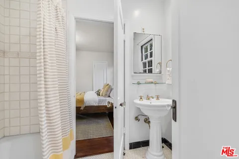 a view of a patio with table and chairs and potted plants