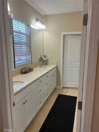 a bathroom with a sink and mirror