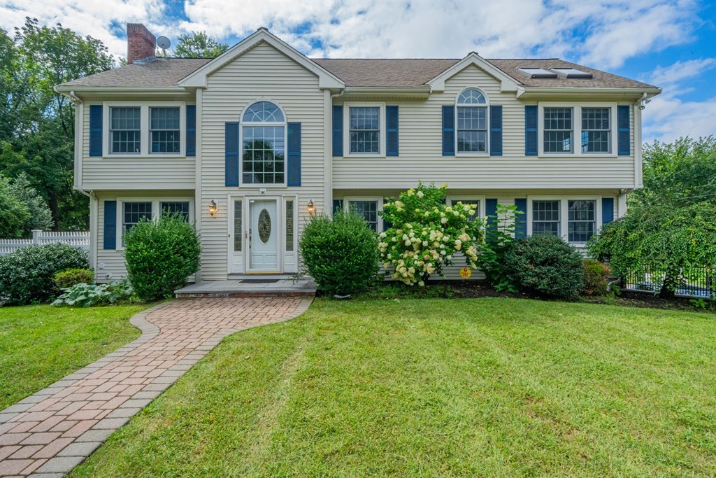 55 School Street Lexington, MA 02421 - Photo 1 of 1 a front view of a house with a garden
