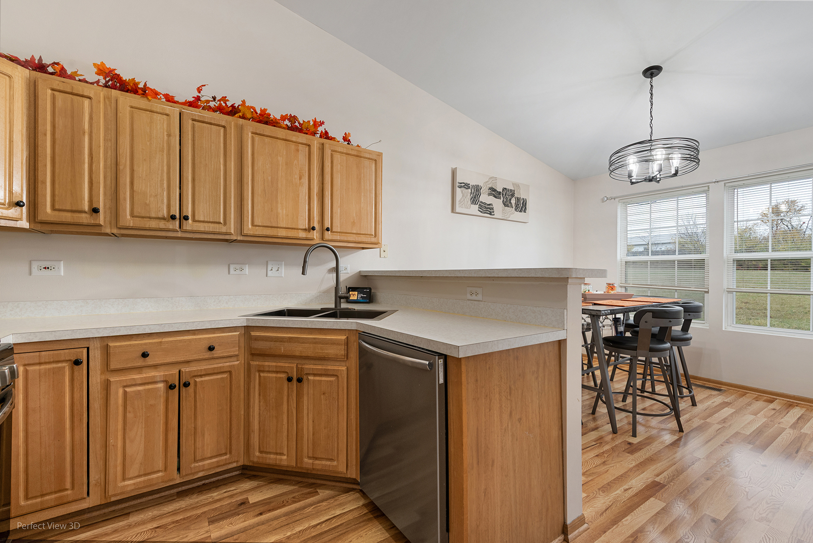 1310 Harvest Drive Crest Hill, IL 60403 - Photo 4 of 21 a kitchen with a sink cabinets and dining table chair