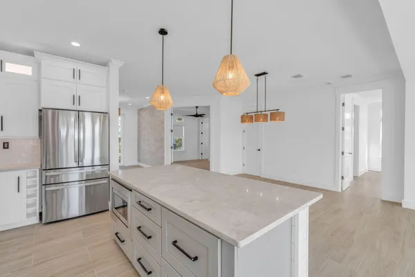a kitchen with cabinets and stainless steel appliances
