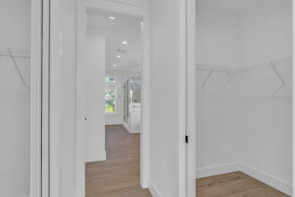 a bathroom with a granite countertop sink a toilet and shower