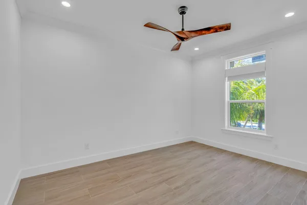 a kitchen with stainless steel appliances granite countertop a sink and a refrigerator