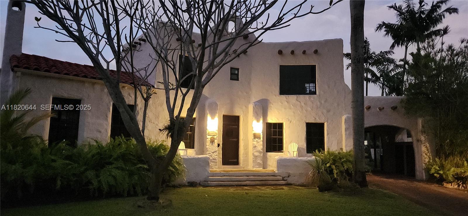 85 Deer Run Miami Springs, FL 33166 - Photo 1 of 21 a front view of a house with garden