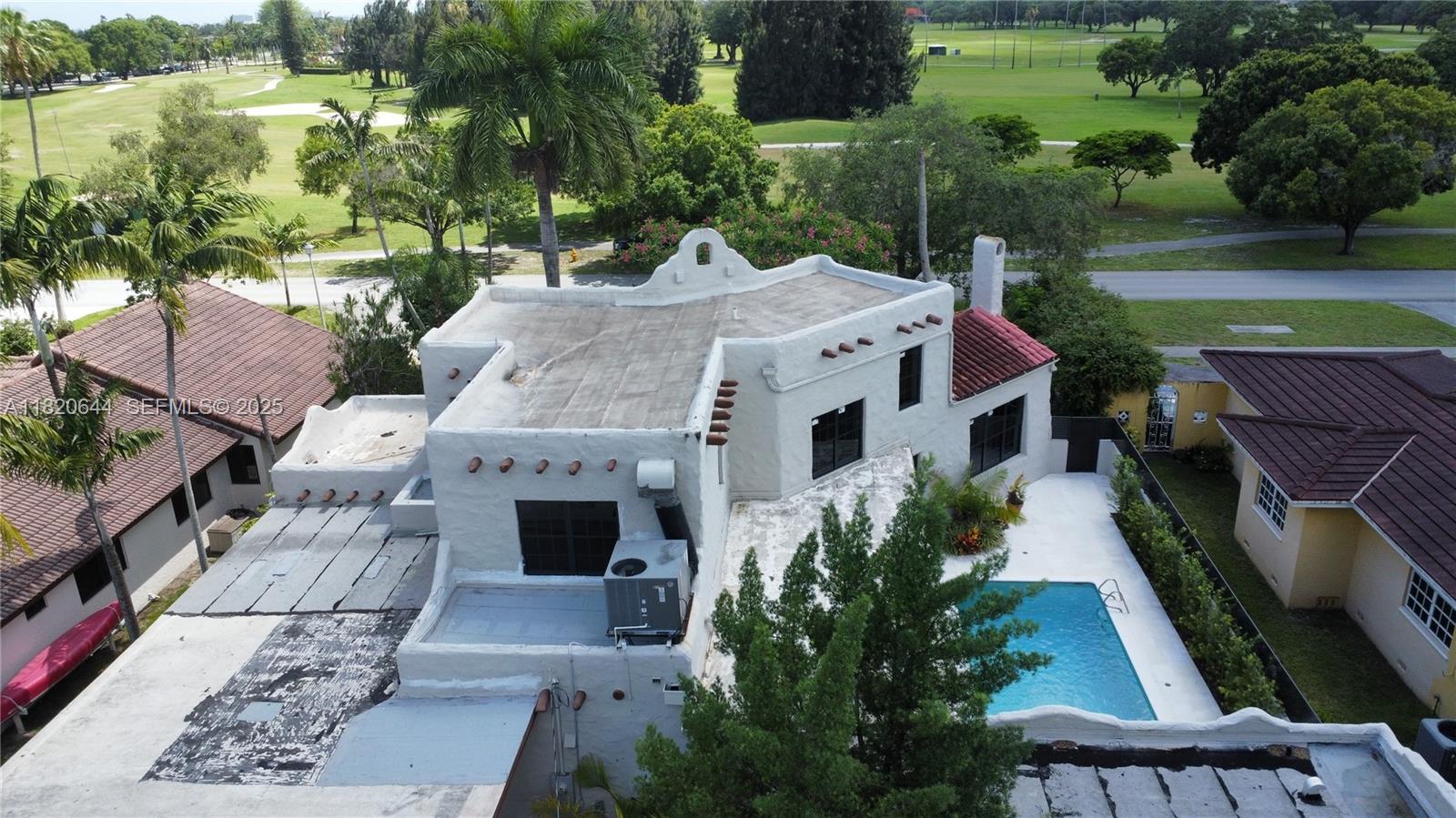 85 Deer Run Miami Springs, FL 33166 - Photo 20 of 21 an aerial view of a house with garden space and street view
