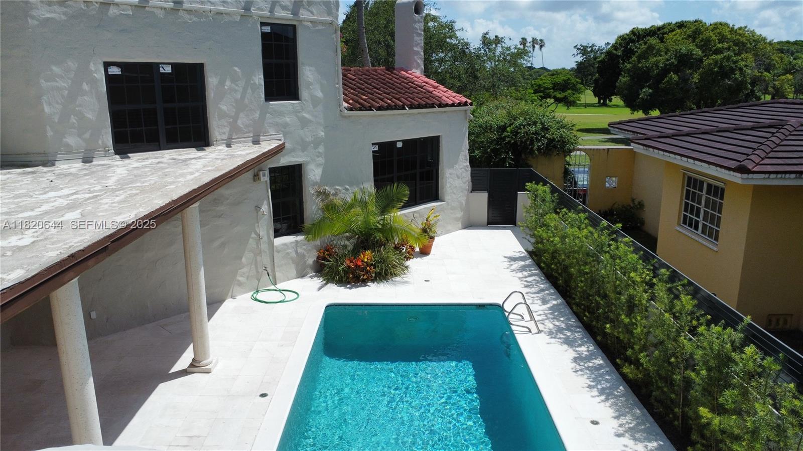 85 Deer Run Miami Springs, FL 33166 - Photo 21 of 21 a view of a house with a yard